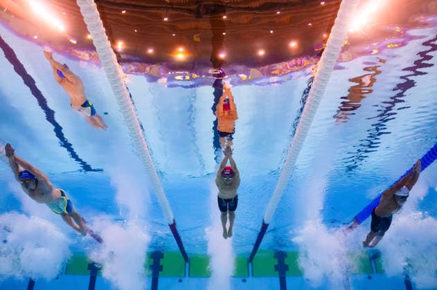 August 12, 2026: Isak Dag Brisenfeldt of the Faroe Islands, Marius Roscan of Switzerland, and Nathan Cachia of Malta compete in the men’s 100-meter butterfly swimming heats during Day 13 of the 2026 European Aquatics Championships on August 12, 2026 in Saint Denis. Photo by Joel Marklund. BILDBYRAN code JM JM0840 bbeng swimming 2026 European Aquatics Championships EM  Copyright: JOELxMARKLUND BB260812JM060