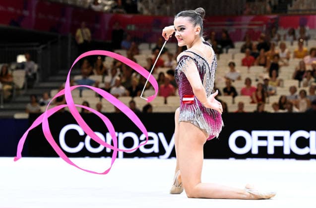 August 12, 2026, xhbx, 2026 Rhythmic Gymnastics World Championships, from left: Dina Mironskaya, Austria with ribbon. DFL DFB REGULATIONS PROHIBIT ANY USE OF PHOTOGRAPHS as IMAGE SEQUENCES and or QUASI-VIDEO. Frankfurt am Main