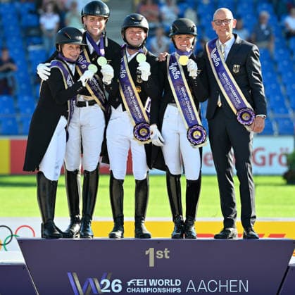 Aachen, Main Stadium, August 12, 2026, GER, FEI World Championships Aachen 2026, Lambertz Prize, Grand Prix Team Dressage—Winning photo of the World Champion Team Germany (from left): Isabell WERTH (Germany), Frederic WANDRES (Germany), Raphael NETZ (Germany), Katharina HEMMER (Germany), and team manager Klaus ROESER (Germany, North Rhine-Westphalia, Germany)