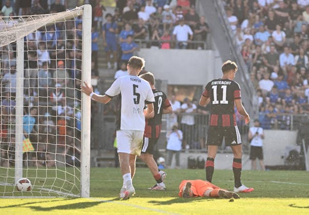 August 12, 2026, xfux, Soccer Friendly Match, FSV Frankfurt vs. Eintracht Frankfurt, from left: Lucas Becker (FSV Frankfurt), Younes Ebnoutalib (Eintracht Frankfurt) – Goal scored, Goal making it 0–2. DFL and DFB regulations prohibit any use of photographs as image sequences and or quasi-video. Frankfurt am Main