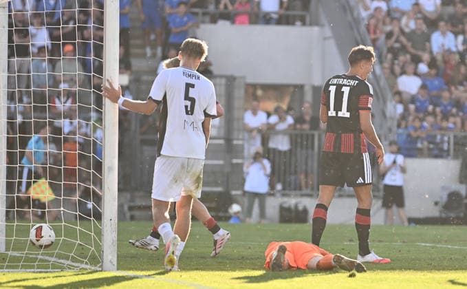 August 12, 2026, xfux, Soccer Friendly Match, FSV Frankfurt vs. Eintracht Frankfurt, from left: Lucas Becker (FSV Frankfurt), Younes Ebnoutalib (Eintracht Frankfurt) – Goal scored, Goal making it 0–2. DFL and DFB regulations prohibit any use of photographs as image sequences and or quasi-video. Frankfurt am Main