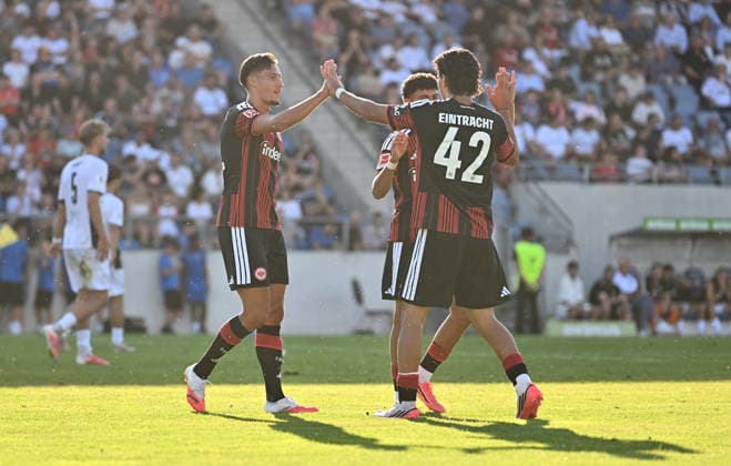 August 12, 2026, xfux, Soccer Friendly Match, FSV Frankfurt vs. Eintracht Frankfurt, from left: Goal scorers Younes Ebnoutalib (Eintracht Frankfurt), Ansgar Knauff (Eintracht Frankfurt), Can Uzun (Eintracht Frankfurt); goal celebration, Celebration, Goal celebration, celebrating the goal, cheering after the 2–0 win, celebrating after the final whistle. DFL and DFB regulations prohibit any use of photographs as image sequences and or quasi-video. Frankfurt am Main