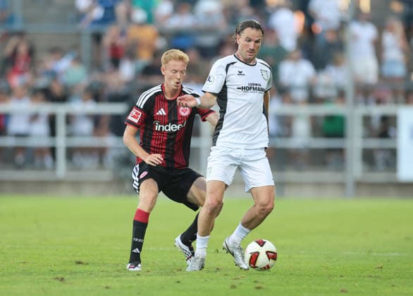 August 12, 2026, Soccer friendly match, FSV Frankfurt vs. Eintracht Frankfurt, from left: Hugo Larsson (Eintracht Frankfurt), Cas Peters (FSV Frankfurt). DFL and DFB regulations prohibit any use of photographs as image sequences and or quasi-video. xdcx Copyright: HMBxMedia Claus