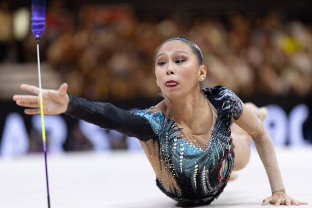 Rhythmic Gymnastics World Championships: Aibota Yertaikyzy of Kazakhstan jumps after one of her clubs, but she grabs it too late Rhythmic Gymnastics World Championships from August 11 to 16 at the Festhalle in Frankfurt am Main Qualifying Round Day 2, Frankfurt am Main, Hesse, Germany, Festhalle
