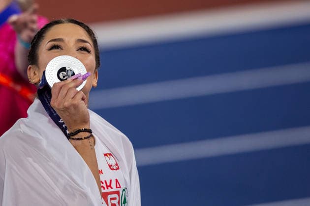Ewa Swoboda of Poland kisses her silver medal after the Womens 100m at the European Athletics Championships at Alexander Stadium in Birmingham, England Copyright: xSeanxWalshx Sportspressphoto_SPR205548