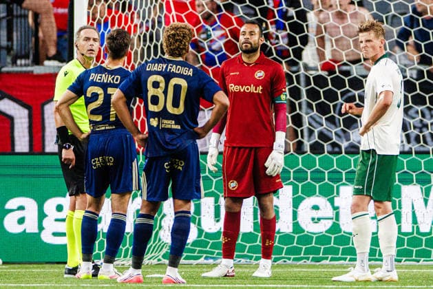 August 13, 2026: Referee Luca Pairetto and Hammarby goalkeeper Warner Hahn during the UEFA Conference League qualifying soccer match between Hammarby and Rakow on August 13, 2026 in Stockholm. Photo by Kenta Jönsson, BILDBYRAN COP 210 KJ0361. soccer, football, UEFA Conference League, Hammarby, Rakow, bbeng  Copyright: KENTAxJÖNSSON BB260813KJ062