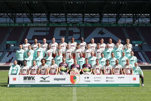 FC Augsburg 1907, Bundesliga 1, Photo Session 2026–2027, Team Photo, Bottom Row from Left: Equipment Manager Christoph Schade, Nathanaël Mbuku, Mads Pedersen, Han Noah Massengo, Fabian Rieder, Nediljko Labrovic, Finn Dahmen, Tom Wisbereit, Tim Schnitzer, Faik Sakar, Alexis Claude Maurice, Hennes Behrens, equipment manager Salvatore Belardo; second row from left: physical therapist Marcel Schoder, physical therapist Julian Binder, goalkeeper coach Michael Weirich, assistant coach Frank Fröhling, head coach Manuel Baum, Assistant Coach Alexander Frankenberger, Assistant Coach Felix Kling, Game and Video Analyst Benedikt Brust, Rehabilitation and Strength and Conditioning Coach Andreas Bäumler, Rehabilitation and Strength and Conditioning Coach Frank Roßner, Rehabilitation and Strength and Conditioning Coach Christian Hahn Third row from the left: Physical Therapist Tim Gulde, Team Doctor Dr. Andreas Weigel, team doctor Dr. Jens Ulrich Otto, Uchenna Ogundu, Robin Fellhauer, Anton Kade, Rodrigo Ribeiro, Mert KömuÌˆr, Kristijan JakiÄ‡, physical therapist David MuÌˆller, team coordinator Jan Reckord, team manager Philipp Dolla; top row, from left: Marius Wolf, Steve Mounià, Tim Breithaupt, Michael Gregoritsch, Calvin Brackelmann, Noahkai Banks, Chrislain Matsima, Jeffrey Gouweleeuw, Keven Schlotterbeck, Sima Suso, Thomas Kastanaras, Yannik Keitel Augsburg Bayern Germany Copyright: ximago kolbert-press ChristianxKolbertx