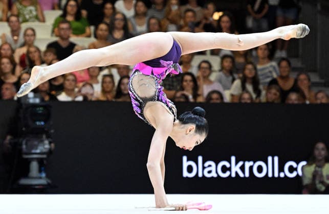 August 14, 2026, xhbx, 2026 Rhythmic Gymnastics World Championships, from left: Qi Wang (China), Cologne, DFL, DFB. REGULATIONS PROHIBIT ANY USE OF PHOTOGRAPHS AS IMAGE SEQUENCES AND OR QUASI-VIDEO. Frankfurt am Main