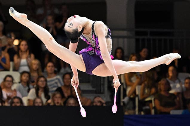 August 14, 2026, xhbx, 2026 Rhythmic Gymnastics World Championships, from left: Qi Wang (China), Cologne, DFL, DFB. REGULATIONS PROHIBIT ANY USE OF PHOTOGRAPHS AS IMAGE SEQUENCES AND OR QUASI-VIDEO. Frankfurt am Main