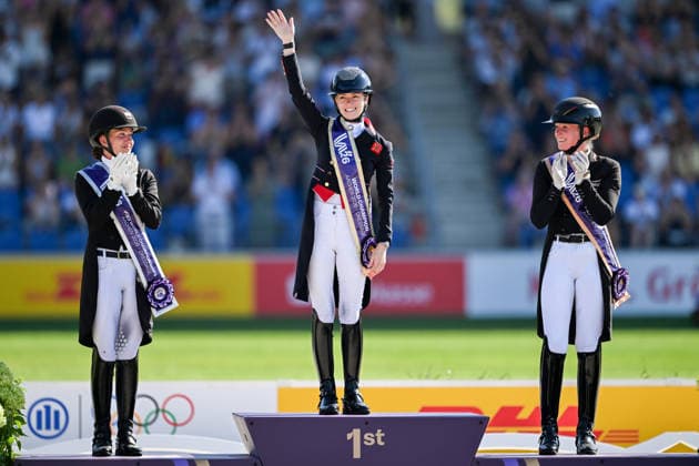 August 14, 2026: Cathrine Laudrup Dufour of Denmark celebrates second place, Charlotte Fry of Great Britain celebrates first place, and Katharina Hemmer of Germany celebrates third place on the podium after competing in the Dressage Grand Prix Special on Day 4 of the 2026 FEI World Championships on August 14, 2026 in Aachen. Photo by Emma Wallskog. BILDBYRAN code EW EW0682 equestrian sports 2026 World Championships 2026 FEI World Championships BBENG equestrian sports World Championships dressage celebration  Copyright: EMMAxWALLSKOG BB260814EW098