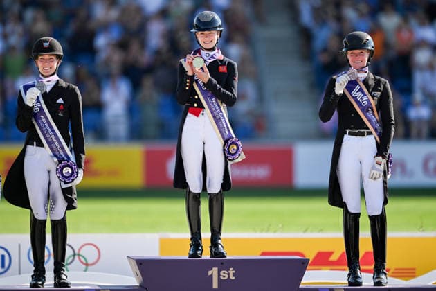 August 14, 2026: Cathrine Laudrup Dufour of Denmark celebrates second place, Charlotte Fry of Great Britain celebrates first place, and Katharina Hemmer of Germany celebrates third place on the podium after competing in the Dressage Grand Prix Special on Day 4 of the 2026 FEI World Championships on August 14, 2026 in Aachen. Photo by Emma Wallskog. BILDBYRAN code EW EW0682 equestrian sports 2026 World Championships 2026 FEI World Championships BBENG equestrian sports World Championships dressage celebration  Copyright: EMMAxWALLSKOG BB260814EW099