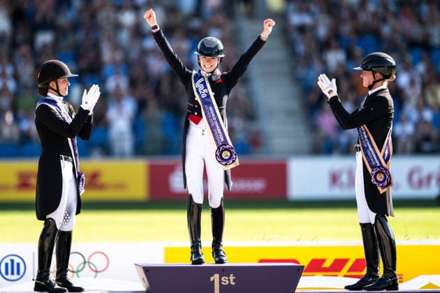 August 14, 2026: Cathrine Laudrup Dufour of Denmark celebrates second place, Charlotte Fry of Great Britain celebrates first place, and Katharina Hemmer of Germany celebrates third place on the podium after competing in the Dressage Grand Prix Special on Day 4 of the 2026 FEI World Championships on August 14, 2026 in Aachen. Photo by Emma Wallskog. BILDBYRAN code EW EW0682 equestrian sports 2026 World Championships 2026 FEI World Championships BBENG equestrian sports World Championships dressage celebration  Copyright: EMMAxWALLSKOG BB260814EW100