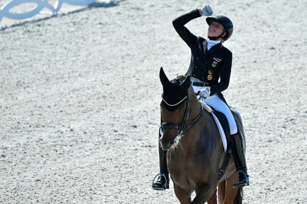 Aachen, Main Stadium, August 14, 2026, GER, FEI World Championships Aachen 2026, Meggle Prize, Grand Prix Special Dressage—Photo: Celebrations, emotion, and joy for Katharina HEMMER of Germany riding Denoix PCH after placing third and winning the bronze medal in North Rhine-Westphalia, Germany