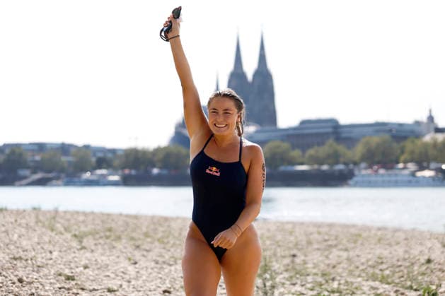 Extreme swimmer Nathalie Pohl crossing the finish line after the fourth leg of her swim from Bad Honnef to Cologne. The athlete swam 200 kilometers across the Rhine for a good cause. The donations will be used to help children learn to swim. Cologne, August 14, 2026, North Rhine-Westphalia, Germany Copyright: xChristophxHardtx