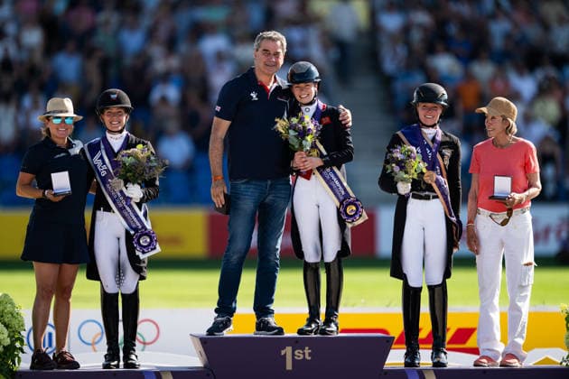 August 14, 2026: Cathrine Laudrup Dufour of Denmark with the owner of the horse Mount St. John Freestyle, Charlotte Fry of Great Britain with the owner of the horse Glamourdale and Katharina Hemmer of Germany with the owner of the horse Denoix celebrate on the podium after the Dressage Grand Prix Special on day 4 of the 2026 FEI World Championships on August 14, 2026 in Aachen. Photo by Emma Wallskog, BILDBYRAN, code EW EW0682. equestrian sports, 2026 World Championships, 2026 FEI World Championships, BBENG, equestrian World Championships, dressage, celebration Copyright: EMMAxWALLSKOG BB260814EW120