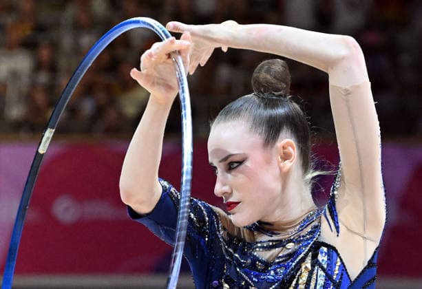 August 14, 2026, xhbx, 2026 Rhythmic Gymnastics World Championships, from left: Darja Varfolomeev, Germany, hoop, DFL, DFB. REGULATIONS PROHIBIT ANY USE OF PHOTOGRAPHS AS IMAGE SEQUENCES AND OR QUASI-VIDEO. Frankfurt am Main