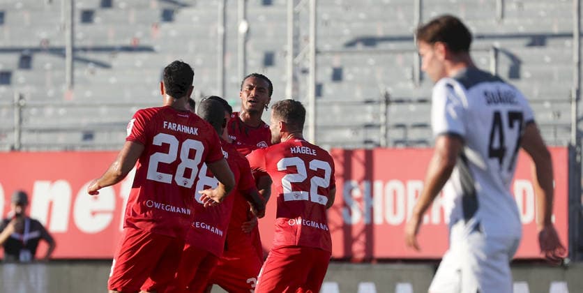 August 14, 2026, xfsx, Men s, Soccer, 2026–2027 Season, 3rd Division, Matchday 2: FC Würzburger Kickers vs. SV Wehen Wiesbaden; from left: Ebrahim Fahrahnak (FC Würzburger Kickers), Dominic Schmidt (FC Würzburger Kickers), David Abrangao (FC Würzburger Kickers), Daniel Haegele (FC Würzburger Kickers) celebrating the goal, goal celebration, celebrating the 1–0 goal scored by Daniel Haegele (FC Würzburger Kickers), David Suarez (SV Wehen Wiesbaden), Wurzburg, AKON ARENA, Bavaria, Germany