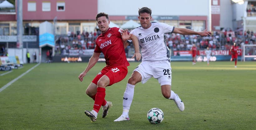 August 14, 2026, xfsx, Men s, Soccer, 2026–2027 Season, 3rd Division, Matchday 2: FC Würzburger Kickers vs. SV Wehen Wiesbaden; from left: Tim Kraus (FC Würzburger Kickers), Jakob Lewald (SV Wehen Wiesbaden); Würzburg, AKON ARENA, Bavaria, Germany
