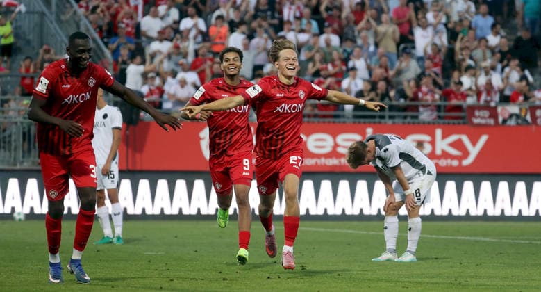 August 14, 2026, xfsx, Men s, Soccer, 2026–2027 Season, 3rd Division, Matchday 2: FC Würzburger Kickers vs. SV Wehen Wiesbaden; from left: Tarsis Bonga (FC Würzburger Kickers), Jermain Nischalke (FC Würzburger Kickers), Xaver Kiefersauer, FC Würzburger Kickers, celebrating a goal, goal celebration, celebrating the 3–0 goal, Fabian Greilinger, SV Wehen Wiesbaden, looking disappointed, disappointment, Würzburg AKON ARENA, Bavaria, Germany
