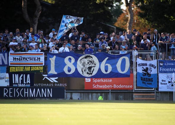 Soccer, Men s, Bavarian Regional League, 2026–2027 Season, FC Memmingen vs. TSV 1860 Munich, at Arena Park in Memmingen Stadium. Here are the TSV 1860 Munich fans in their fan section, with a lively atmosphere, banners, and flags.