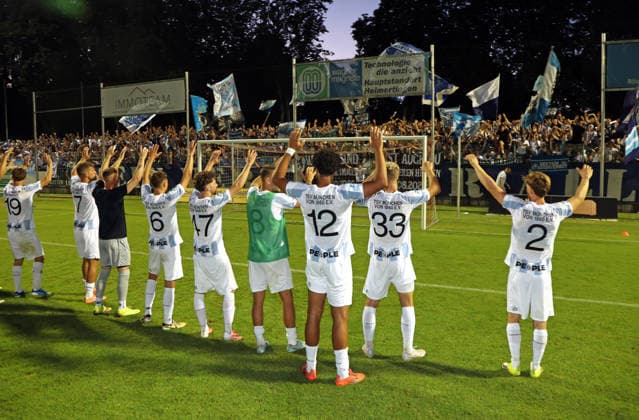 Soccer, Men s, Bavarian Regional League, 2026–2027 Season, FC Memmingen vs. TSV 1860 Munich, at Arena Park in Memmingen Stadium. The TSV 1860 Munich team celebrating together in front of the fan section after the game; fans