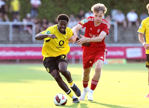 Friday, August 14, 2026, 2026–27 season, Matchday 3 of the Regionalliga West at the Belkaw Arena in Bergisch Gladbach: SV Bergisch Gladbach 09 vs. BVB 09 Borussia Dortmund II; Nanitonda Quiala of BVB II in a tackle