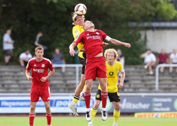 Friday, August 14, 2026, 2026–27 season, Matchday 3 of the Regionalliga West at the Belkaw Arena in Bergisch Gladbach: SV Bergisch Gladbach 09 vs. BVB 09 Borussia Dortmund II; Luke Fahrenhorst of BVB II in a header duel