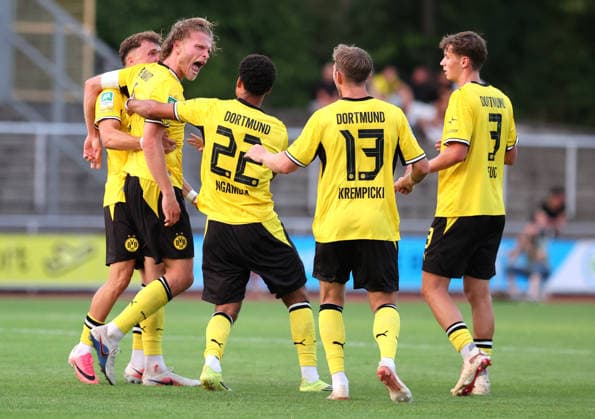 Friday, August 14, 2026, 2026–27 season, Matchday 3 of the Regionalliga West at the Belkaw Arena in Bergisch Gladbach, SV Bergisch Gladbach 09 vs. BVB 09 Borussia Dortmund II; Dortmund celebrates its 2–1 victory—Jesper Verlaat (BVB II), Diego Ngambia Dzonga (BVB II), Connor Krempicki (BVB II), and Finn Fuchs (BVB II), from left to right