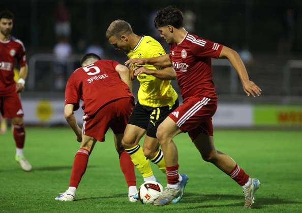 Friday, August 14, 2026, 2026–27 season, Matchday 3 of the Regionalliga West at the Belkaw Arena in Bergisch Gladbach: SV Bergisch Gladbach 09 vs. BVB 09 Borussia Dortmund II; Mario Pejazic of BVB II in a tackle