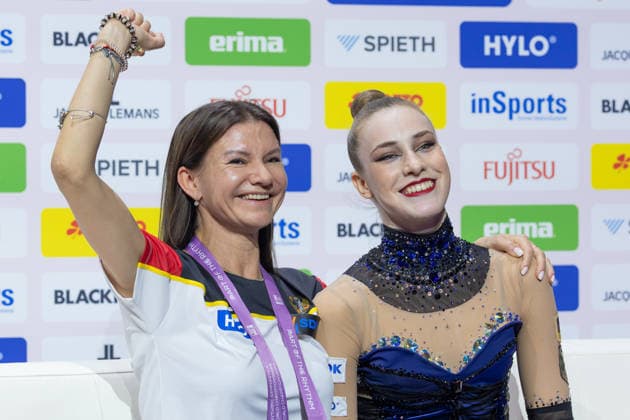 Rhythmic Gymnastics World Championships: Coach Yuliya Raskina celebrates with Darja Varfolomeev of Germany after her successful ribbon routine. Rhythmic Gymnastics World Championships, August 11–16 at the Festhalle in Frankfurt am Main. Individual All-Around Final, Places 1–9, Frankfurt am Main, Hesse, Germany, Festhalle