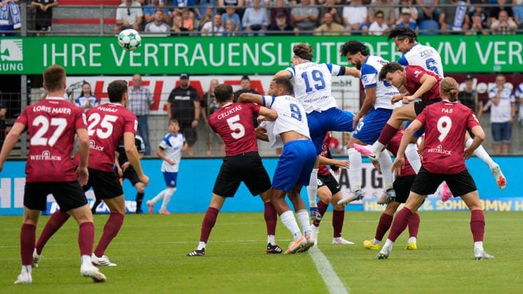 August 15, 2026, Hänsch Arena, Meppen, GER, 3rd Division, Matchday 2: SV Meppen vs. SG Sonnenhof Großaspach, header 1–0 by Stefan Rankic (SV Meppen 33), 2 Meppen players v r DFL REGULATIONS PROHIBIT ANY USE OF PHOTOGRAPHS AS IMAGE SEQUENCES AND OR QUASI-VIDEO Meppen, Lower Saxony, Hänsch Arena