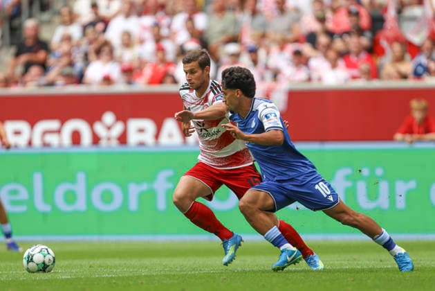 Tim Oberdorf of Fortuna Düsseldorf and Yasin Batuhan Muhammed Zor of TSG Hoffenheim II in a tackle during the 3. Liga match between Fortuna Düsseldorf and TSG 1899 Hoffenheim II, Merkur Spiel Arena on August 15, 2026, in Düsseldorf, Germany. Photo by Oliver Kaelke, DeFodi Images. Tim Oberdorf of Fortuna Düsseldorf and Yasin Batuhan Muhammed Zor of TSG Hoffenheim II battle for the ball during the 3. Liga match between Fortuna Düsseldorf and TSG 1899 Hoffenheim II at Merkur Spiel Arena on August 15, 2026 in Düsseldorf, Germany. Photo by Oliver Kaelke, DeFodi Images. DFB and DFL regulations prohibit any use of photographs as image sequences and or quasi-video. Photo by Oliver Kaelke, DeFodi Images.