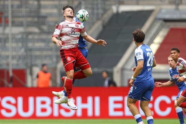 Eric Hottmann of Fortuna Düsseldorf and Valentin Laessig of TSG Hoffenheim II battle for the ball during the 3. Liga match between Fortuna Düsseldorf and TSG 1899 Hoffenheim II at the Merkur Spiel Arena on August 15, 2026, in Düsseldorf, Germany. Photo by Oliver Kaelke, DeFodi Images. Eric Hottmann of Fortuna Düsseldorf and Valentin Laessig of TSG Hoffenheim II battle for the ball during the 3. Liga match between Fortuna Düsseldorf and TSG 1899 Hoffenheim II at Merkur Spiel Arena on August 15, 2026 in Düsseldorf, Germany. Photo by Oliver Kaelke, DeFodi Images. DFB and DFL regulations prohibit any use of photographs as image sequences and or quasi-video. Photo by Oliver Kaelke, DeFodi Images.