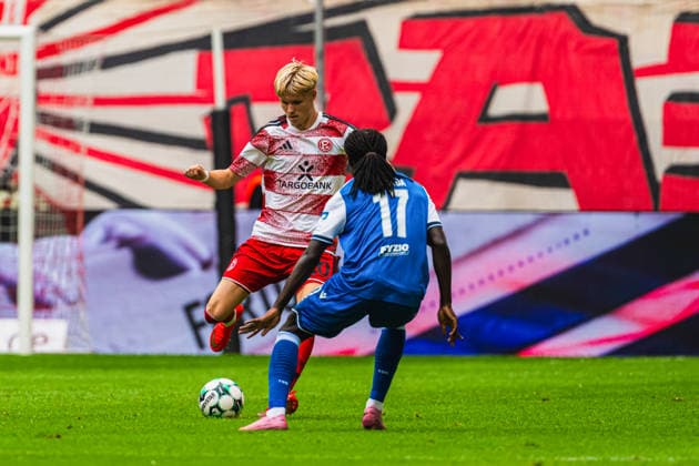 Felix Meiser of Fortuna Düsseldorf, 20, building up play against Blessing Makanda of TSG Hoffenheim II, 17; Fortuna Düsseldorf vs. TSG Hoffenheim II, soccer, 3. Liga, Matchday 2, 2026–27 season, August 15, 2026, DFL regulations prohibit any use of photographs as image sequences and or quasi-video, Fortuna Düsseldorf vs. TSG Hoffenheim II, soccer, 3. Liga, Matchday 2, 2026–27 Season, August 15, 2026, Düsseldorf Copyright: xEibner-Pressefoto LukasxBaldygax EP_LBA