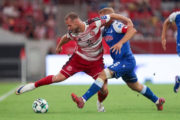 Eric Hottmann of Fortuna Düsseldorf and Valentin Laessig of TSG Hoffenheim II battle for the ball during the 3. Liga match between Fortuna Düsseldorf and TSG 1899 Hoffenheim II at the Merkur Spiel Arena on August 15, 2026, in Düsseldorf, Germany. Photo by Oliver Kaelke, DeFodi Images. Eric Hottmann of Fortuna Düsseldorf and Valentin Laessig of TSG Hoffenheim II battle for the ball during the 3. Liga match between Fortuna Düsseldorf and TSG 1899 Hoffenheim II at Merkur Spiel Arena on August 15, 2026 in Düsseldorf, Germany. Photo by Oliver Kaelke, DeFodi Images. DFB and DFL regulations prohibit any use of photographs as image sequences and or quasi-video. Photo by Oliver Kaelke, DeFodi Images.