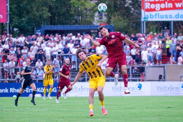 August 15, 2026, xsefx, Soccer, SC Fortuna Köln vs. TSV Alemannia Aachen, 3rd Division, Südstation, Matchday 2, 2026–2027 Season: Nico Thier (Fortuna Cologne 07) in a tackle against Louis Köster (Alemannia Aachen 08). DFB regulations prohibit any use of photographs as image sequences and or quasi-video. North Rhine-Westphalia, Germany