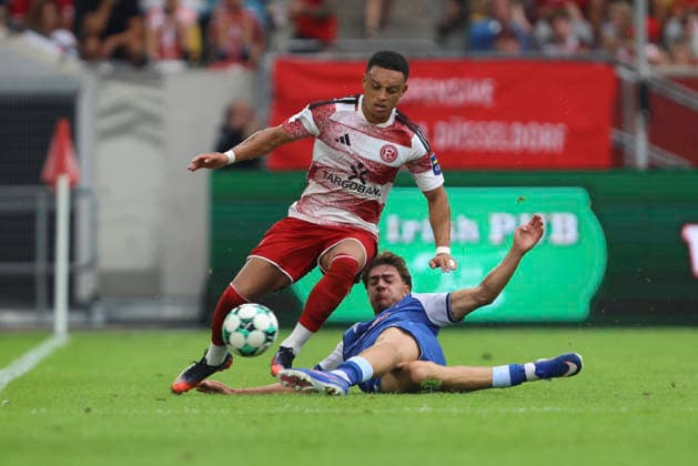 Steven van der Sloot of Fortuna Düsseldorf and Maximilian Raphael Theuer of TSG Hoffenheim II go head-to-head during the 3. Liga match between Fortuna Düsseldorf and TSG 1899 Hoffenheim II, Merkur Spiel Arena on August 15, 2026, in Düsseldorf, Germany. Photo by Oliver Kaelke, DeFodi Images. Steven van der Sloot of Fortuna Düsseldorf and Maximilian Raphael Theuer of TSG Hoffenheim II battle for the ball during the 3. Liga match between Fortuna Düsseldorf and TSG 1899 Hoffenheim II at Merkur Spiel Arena on August 15, 2026 in Düsseldorf, Germany. Photo by Oliver Kaelke, DeFodi Images. DFB and DFL regulations prohibit any use of photographs as image sequences and or quasi-video. Photo by Oliver Kaelke, DeFodi Images.