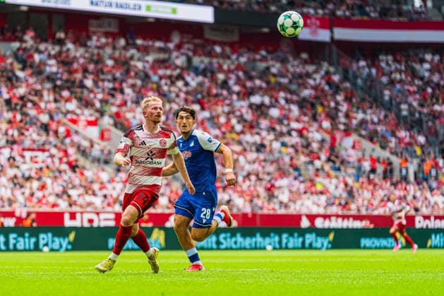 Jomaine Consbruch of Fortuna Düsseldorf, No. 14, in a tackle with Florian Micheler of TSG Hoffenheim II, No. 28; Fortuna Düsseldorf vs. TSG Hoffenheim II, soccer, 3. Liga, Matchday 2, 2026–27 season, August 15, 2026, DFL regulations prohibit any use of photographs as image sequences and or quasi-video, Fortuna Düsseldorf vs. TSG Hoffenheim II, soccer, 3. Liga, Matchday 2, 2026–27 Season, August 15, 2026, Düsseldorf Copyright: xEibner-Pressefoto LukasxBaldygax EP_LBA