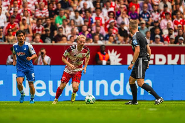 Yasin Zor, TSG Hoffenheim II, 10, Jomaine Consbruch, Fortuna Düsseldorf, 14, on the ball; Martin Wilke, referee, Fortuna Düsseldorf vs. TSG Hoffenheim II, soccer, 3. Liga, Matchday 2, 2026–27 season, August 15, 2026, DFL regulations prohibit any use of photographs as image sequences and or quasi-video. Fortuna Düsseldorf vs. TSG Hoffenheim II, soccer, 3. Liga, Matchday 2, 2026–27 Season, August 15, 2026, Düsseldorf Copyright: xEibner-Pressefoto LukasxBaldygax EP_LBA