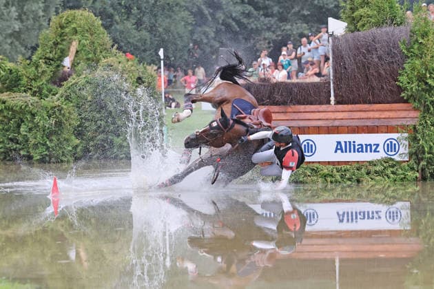 Toshiyuki Tanaka (JPN), Japan, riding Jefferson (JRA), falls at the Allianz Complex during the cross-country phase of the FEI Eventing World Championship, DHL Prize, Individual and Team Events, Cross-Country Test, Cross-Country, AACHEN FEI World Championships 2026, World Equestrian Festival, 2026 World Equestrian Championships, Aachen 2026, Welcome Home 2026, Aachen Soers, August 11–23, 2026, Equestrian Sports, August 15, 2026, Aachen Soers, Germany