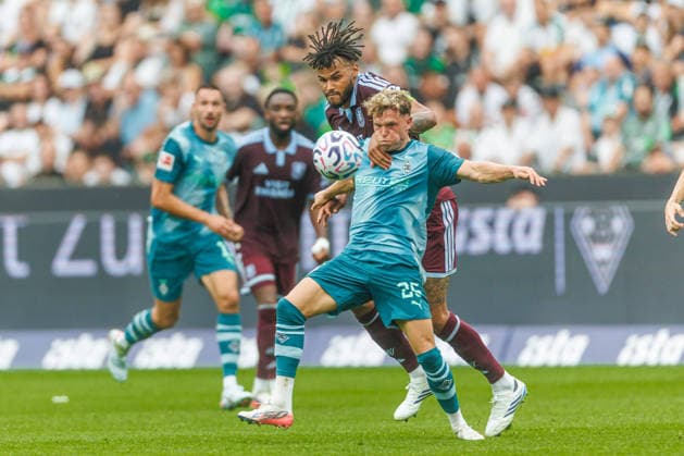 Tyrone Mings of Aston Villa and Robin Hack of Borussia Mönchengladbach battle for the ball during the preseason friendly match between Borussia Mönchengladbach and Aston Villa at ista Borussia Park on August 15, 2026, in Mönchengladbach, Germany. Photo by Mario Hommes, DeFodi Images