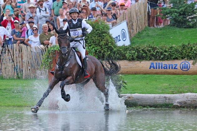 Michael Jung GER, Germany, with his horse fischerChipmunk FRH, Chipmunk FRH, Allianz Insurance, water jump, eventing dressage, FEI Eventing World Championship, DHL Prize, individual and team competitions, cross-country test, cross-country stage, cross-country, AACHEN FEI World Championships 2026, World Festival of Equestrian Sports, 2026 Equestrian World Championships, Aachen 2026, Welcome Home 2026, Aachen Soers, August 11–23, 2026, Equestrian Sports, August 15, 2026, Aachen Soers, Germany