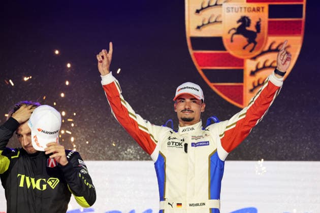 A disappointed Jake Dennis, second in Race 1 and the championship, alongside winner Pascal Wehrlein (GER, Porsche 94), smiling and leading the World Championship, on the podium, FIA Formula E World Championship, Season 12, London E-Prix, August 15, 2026, Excel Exhibition Center,