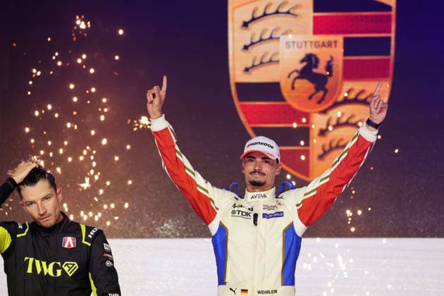 A disappointed Jake Dennis, second in Race 1 and the championship, alongside winner Pascal Wehrlein (GER, Porsche 94), smiling and leading the World Championship, on the podium, FIA Formula E World Championship, Season 12, London E-Prix, August 15, 2026, Excel Exhibition Center,