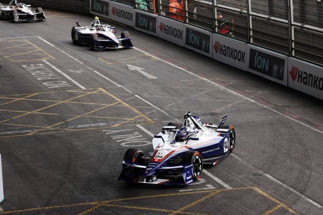 Pascal Wehrlein (GER) in Porsche No. 94 and Nico Mueller (SUI) in Porsche No. 51 in Race 1, FIA Formula E World Championship, Season 12, London E-Prix, August 15, 2026, Excel Exhibition Center