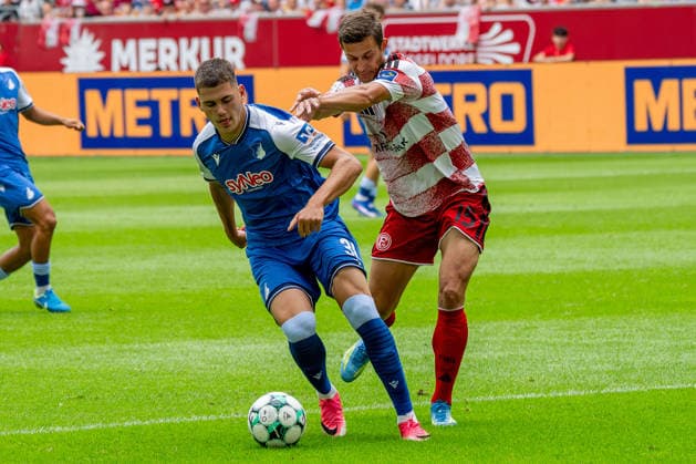 August 15, 2026, xkkux, Soccer, Fortuna Düsseldorf vs. TSG 1899 Hoffenheim II, 3. Liga, MERKUR SPIEL ARENA, Matchday 2, 2026–2027 Season: Jakov Dedic of TSG Hoffenheim II, No. 36, in a tackle against Tim Oberdorf of Fortuna Düsseldorf, No. 15. DFB regulations prohibit any use of photographs as image sequences and or quasi-video. North Rhine-Westphalia, Germany
