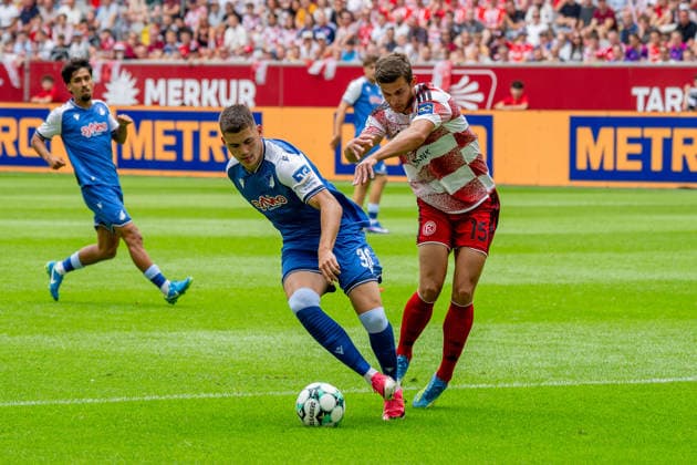 August 15, 2026, xkkux, Soccer, Fortuna Düsseldorf vs. TSG 1899 Hoffenheim II, 3. Liga, MERKUR SPIEL ARENA, Matchday 2, 2026–2027 Season: Jakov Dedic of TSG Hoffenheim II, No. 36, in a tackle against Tim Oberdorf of Fortuna Düsseldorf, No. 15. DFB regulations prohibit any use of photographs as image sequences and or quasi-video. North Rhine-Westphalia, Germany