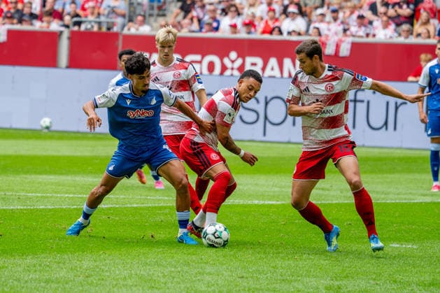 August 15, 2026, xkkux, Soccer, Fortuna Düsseldorf vs. TSG 1899 Hoffenheim II, 3. Liga, MERKUR SPIEL ARENA, Matchday 2, 2026–2027 Season: Yasin Zor (TSG Hoffenheim II) 10 in a tackle against Steven van der Sloot (Fortuna Düsseldorf 02); Tim Oberdorf (Fortuna Düsseldorf) 15. DFB regulations prohibit any use of photographs as image sequences and or quasi-video. North Rhine-Westphalia, Germany