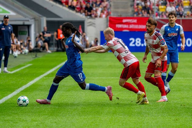 August 15, 2026, xkkux, Soccer, Fortuna Düsseldorf vs. TSG 1899 Hoffenheim II, 3. Liga, MERKUR SPIEL ARENA, Matchday 2, 2026–2027 Season Blessing Makanda (TSG Hoffenheim II, No. 17) in a tackle against Lukas Eixler (Fortuna Düsseldorf, No. 11) Fabian Schleusener (Fortuna Düsseldorf, No. 24) DFB regulations prohibit any use of photographs as image sequences and or quasi-video North Rhine-Westphalia, Germany