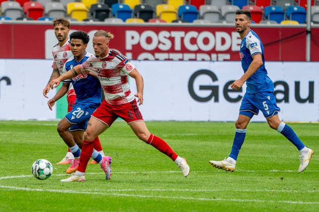 August 15, 2026, xkkux, Soccer, Fortuna Düsseldorf vs. TSG 1899 Hoffenheim II, 3. Liga, MERKUR SPIEL ARENA, Matchday 2, 2026–2027 Season: Jorrit Hendrix of Fortuna Düsseldorf 08 in a tackle against Tiago Poller of TSG Hoffenheim II. DFB regulations prohibit any use of photographs as image sequences and or quasi-video. North Rhine-Westphalia, Germany